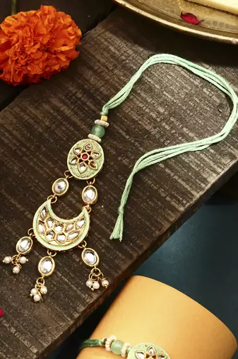 Green meenakari with kundan studded bhaiya bhabhi rakhi