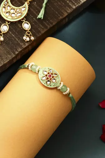 Green meenakari with kundan studded bhaiya bhabhi rakhi