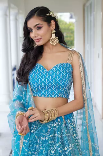 SKY BLUE NET FABRIC LAHENGA WITH SEQUINS AND THREAD EMBROIDERY WORK