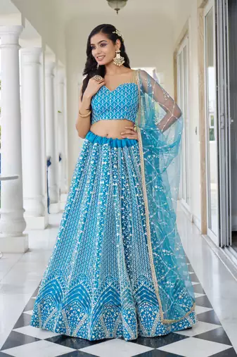 SKY BLUE NET FABRIC LAHENGA WITH SEQUINS AND THREAD EMBROIDERY WORK