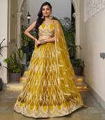 MUSTARD YELLOW NET FABRIC LAHENGA WITH SEQUINS AND THREAD EMBROIDERY WORK