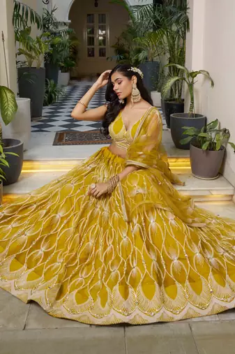 MUSTARD YELLOW NET FABRIC LAHENGA WITH SEQUINS AND THREAD EMBROIDERY WORK