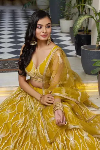 MUSTARD YELLOW NET FABRIC LAHENGA WITH SEQUINS AND THREAD EMBROIDERY WORK