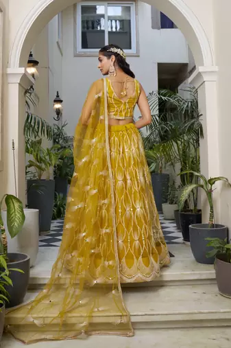 MUSTARD YELLOW NET FABRIC LAHENGA WITH SEQUINS AND THREAD EMBROIDERY WORK