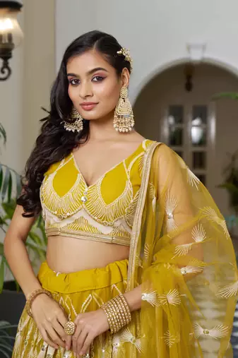 MUSTARD YELLOW NET FABRIC LAHENGA WITH SEQUINS AND THREAD EMBROIDERY WORK
