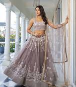 LIGHT DUSTY BROWN  NET FABRIC LAHENGA WITH SEQUINS AND THREAD EMBROIDERY WORK