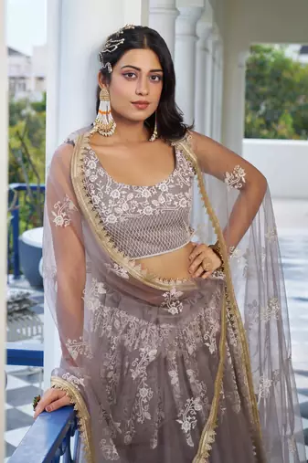LIGHT DUSTY BROWN  NET FABRIC LAHENGA WITH SEQUINS AND THREAD EMBROIDERY WORK