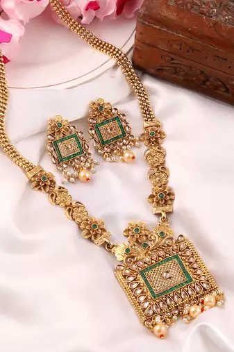 Mansiyaorange matte golden floral design kundan stones long jewellery sets for women