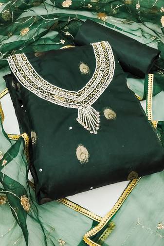 Beautifully handcrafted green colour organza salwar kameez for graceful girlish looks in festive style