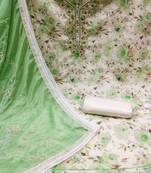 Beautifully handcrafted off white colour cotton silk salwar kameez for graceful festive looks in floral style