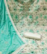 Beautifully handcrafted off white colour cotton silk salwar kameez for graceful festive looks in floral style