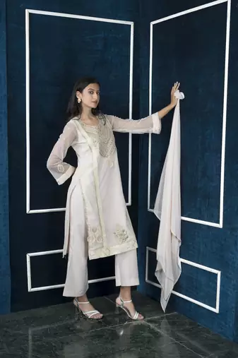 Nikhaar beige embroidered net stitched palazzo kurta & dupatta 