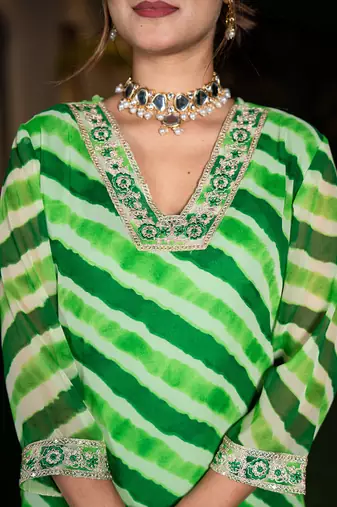  green leheriya print poly georgette straight suit set