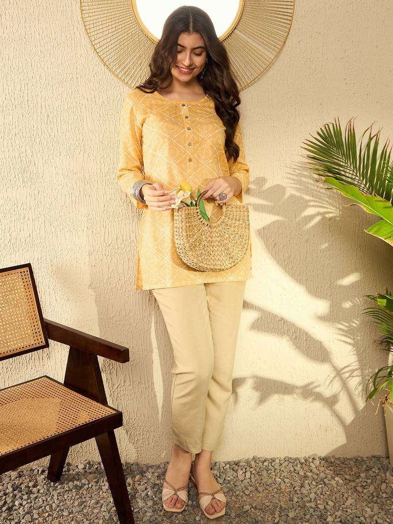 women yellow cotton blend bandhani printed regular tunic