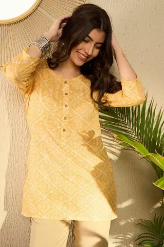 women yellow cotton blend bandhani printed regular tunic