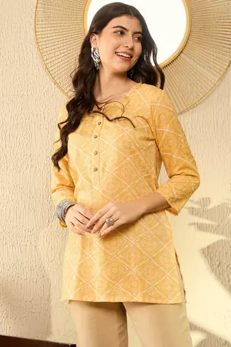 women yellow cotton blend bandhani printed regular tunic