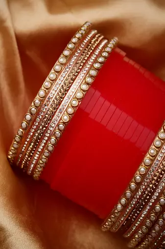 Set Of 24 Gold-Plated Red AD Stone Studded Chuda Set