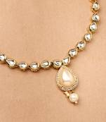 White Gold Kundan Necklace Set with Green Stone