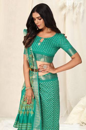 Teal cotton chevron ajrak print woven zari border tassels saree with unstitched blouse piece