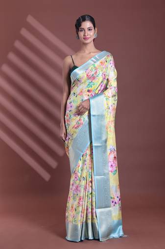Cream floral print silk soft saree with zari border