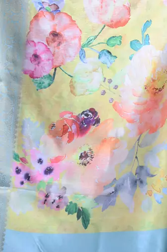 Cream floral print silk soft saree with zari border