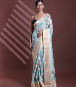 Mint green floral print silk soft saree with zari border