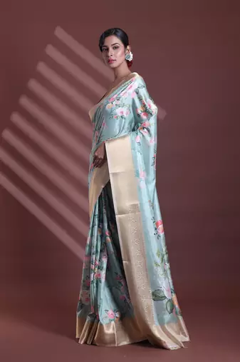 Mint green floral print silk soft saree with zari border