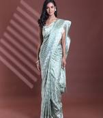 Mint green silk soft saree with abstract print