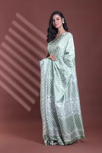 Mint green silk soft saree with abstract print