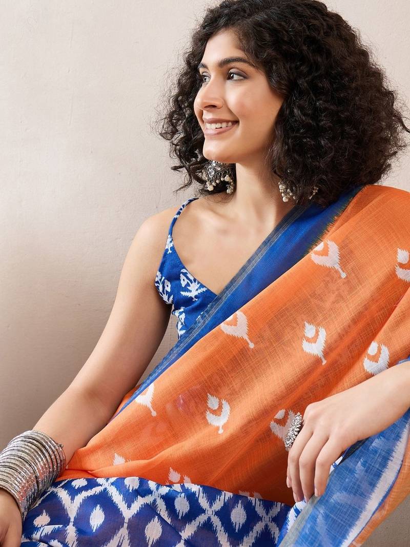women orange linen blend ikat printed saree