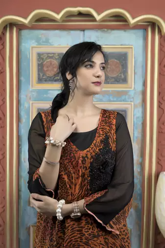 Nikhaar orange embroidered georgette asymmetrical kurta & pants set