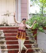 Off-white embroidered Navratri kedia with off-white tulip pant. Elegant outfit for Navratri festival.