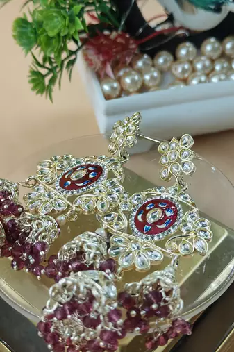   Long earrings with meenakari design and hanging pearls, traditional earrings
