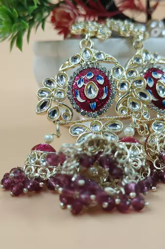   Long earrings with meenakari design and hanging pearls, traditional earrings