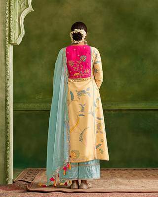 Dresoul yellow embroidered flared kurta set with pink embellished dupatta 3