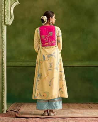 Dresoul yellow embroidered flared kurta set with pink embellished dupatta 4