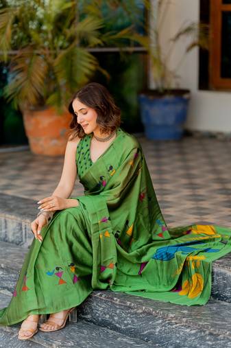 Green chiffon warli print saree with unstitched blouse piece