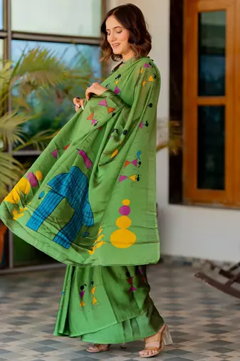 Green chiffon warli print saree with unstitched blouse piece