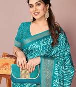 Teal silk blend batik print golden zari woven border saree with unstitched blouse piece