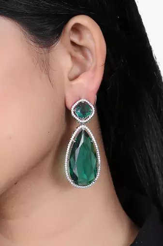 Women rhodium plated green stone studded earrings