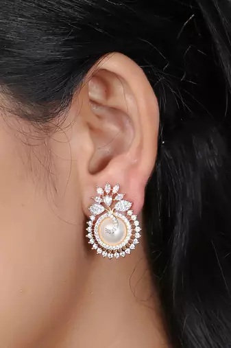 Women gold plated pearl studded studs earrings