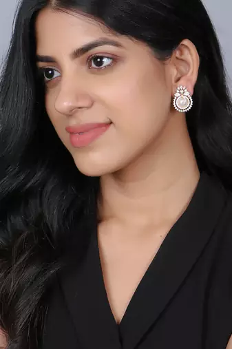 Women gold plated pearl studded studs earrings