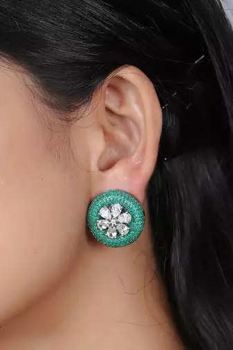 Women flower green stone studded oxidised stud earrings