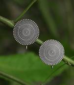 Look like silver circular shaped studs