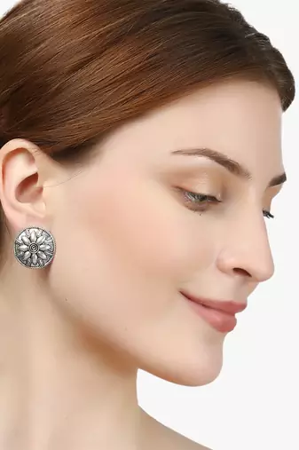 Look like silver circular shaped studs