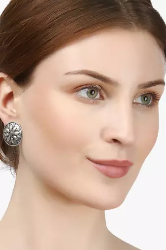 Look like silver circular shaped studs