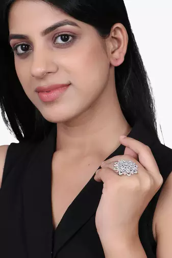 Women rhodium plated stone studded flower shape finger ring