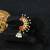 24 ct gold-plated flower stone studded handcrafted nose pin