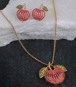 Women gold-plated stone studded pendent and earrings set