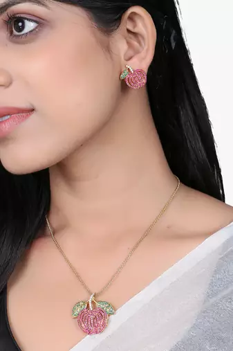 Women gold-plated stone studded pendent and earrings set
